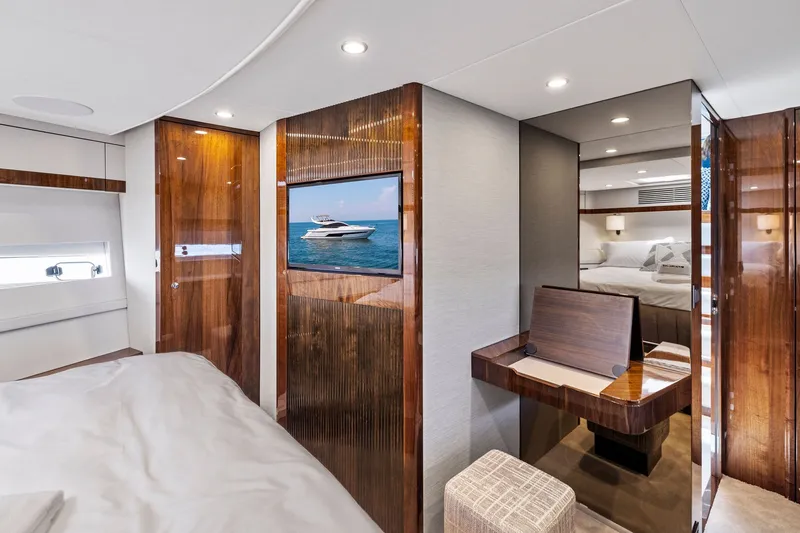 Slide: The Image of Luxurious interior of 2024 Fairline Phantom 65 yacht with elegant wood finishes and modern amenities. - 50