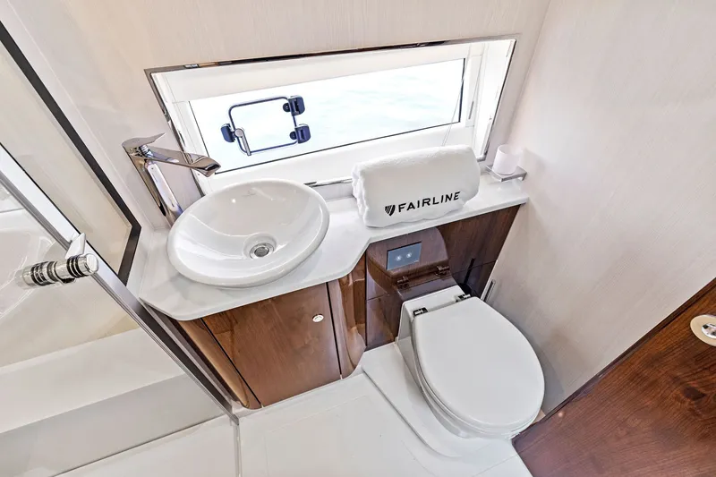 Slide: The Image of Luxury bathroom in 2024 Fairline Phantom 65 yacht with modern fixtures and elegant design. - 42