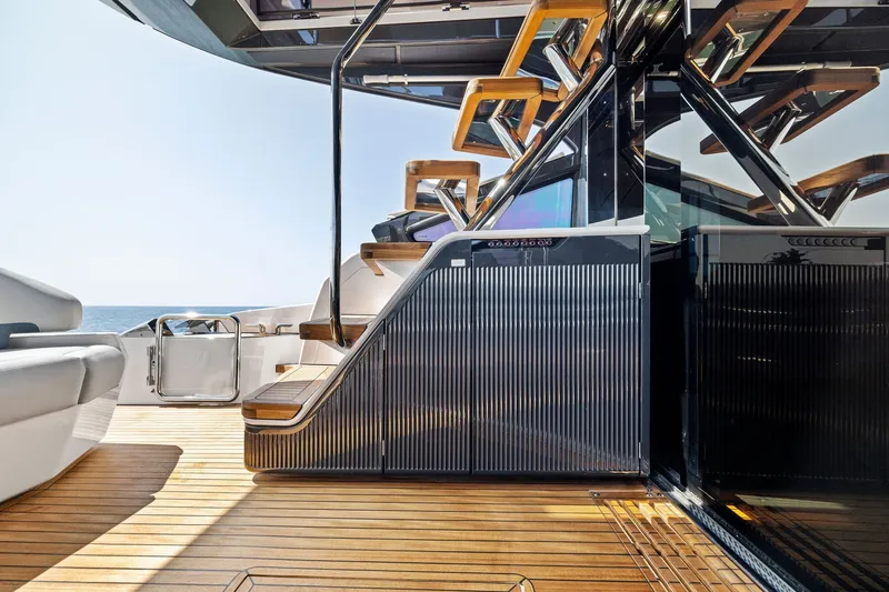 Slide: The Image of Luxurious 2024 Fairline Phantom 65 yacht deck with modern staircase and sleek design. - 9