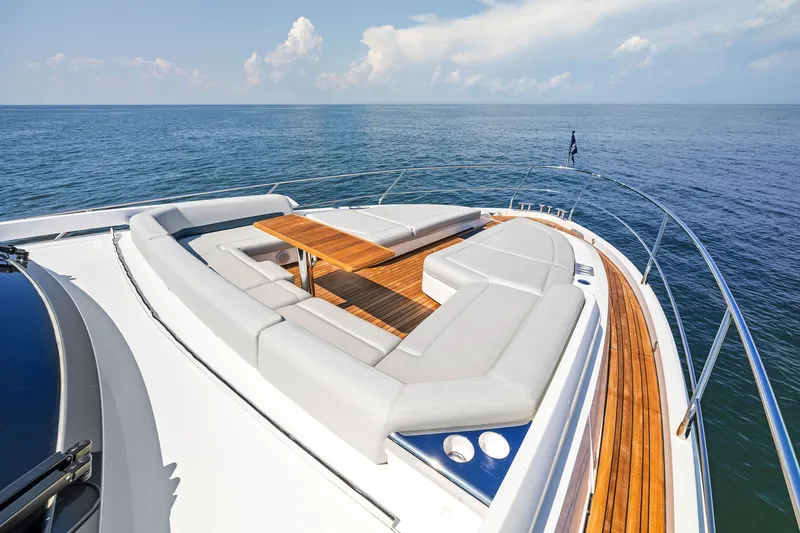 Slide: The Image of Luxurious 2024 Fairline Phantom 65 yacht deck with elegant seating and ocean view. - 71