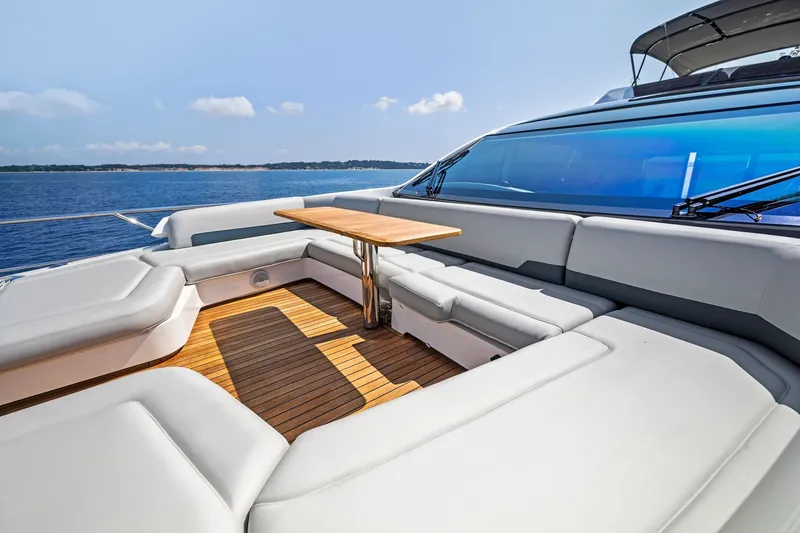 Slide: The Image of Luxurious 2024 Fairline Phantom 65 yacht deck with elegant seating and ocean view. - 68