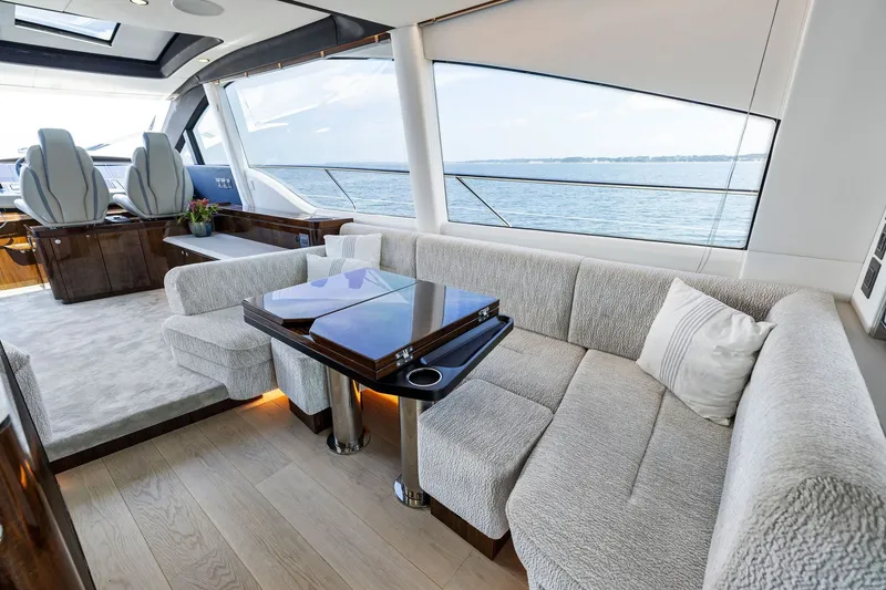 Slide: The Image of Luxurious interior of 2024 Fairline Phantom 65 yacht with elegant seating and ocean view. - 16