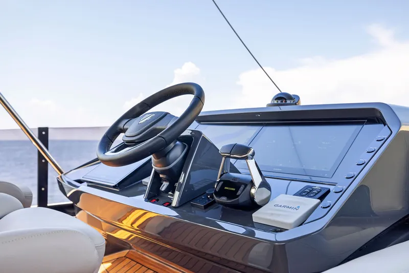 Slide: The Image of Helm of 2024 Fairline Phantom 65 yacht with modern navigation equipment. - 64
