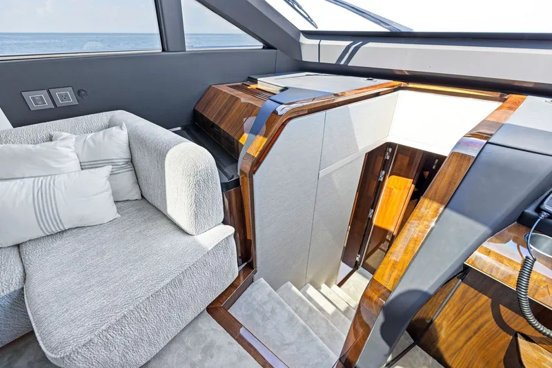 Slide: The Image of Luxurious interior of 2024 Fairline Phantom 65 yacht with plush seating and elegant wood finishes. - 24