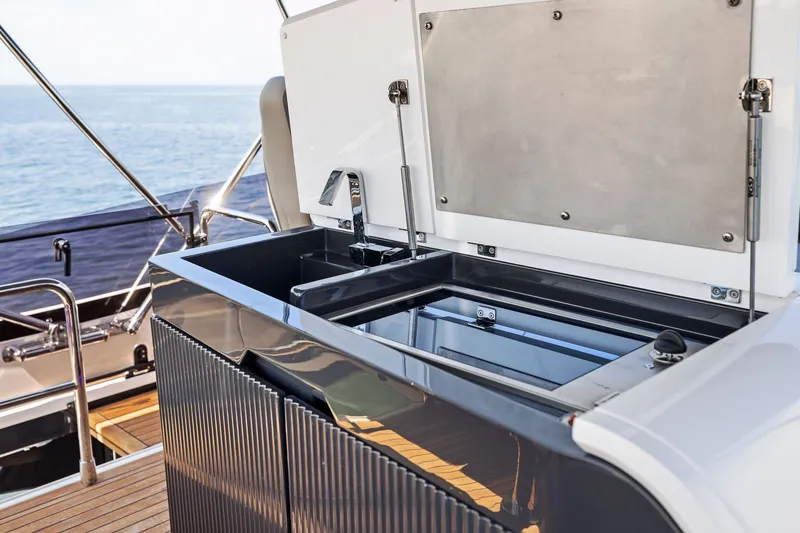Slide: The Image of Luxury outdoor kitchen on 2024 Fairline Phantom 65 yacht, featuring sleek design and ocean view. - 54