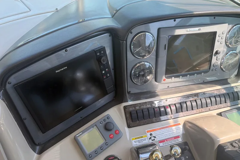 Slide: The Image of Control panel of a 2007 Sea Ray 40 Sundancer boat with navigation equipment. - 9