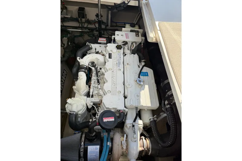 Slide: The Image of Engine compartment of a 2007 Sea Ray 40 Sundancer boat, showcasing detailed components. - 33