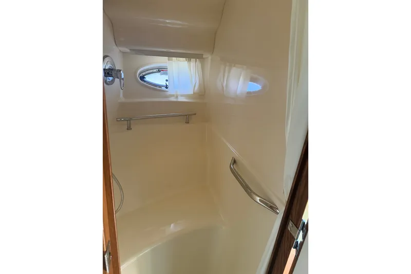 Slide: The Image of Interior of 2007 Sea Ray 40 Sundancer yacht bathroom with porthole and handrails. - 13