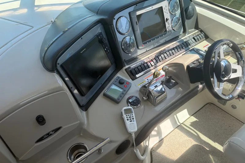 Slide: The Image of Control panel of a 2007 Sea Ray 40 Sundancer yacht with navigation equipment. - 22