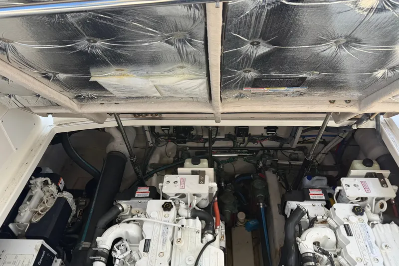Slide: The Image of Engine compartment of a 2007 Sea Ray 40 Sundancer, showcasing dual engines and mechanical components. - 29