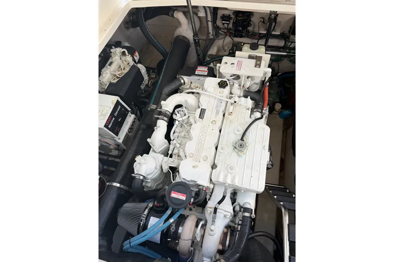 Slide: The Image of Engine compartment of a 2007 Sea Ray 40 Sundancer boat, showcasing detailed machinery. - 30