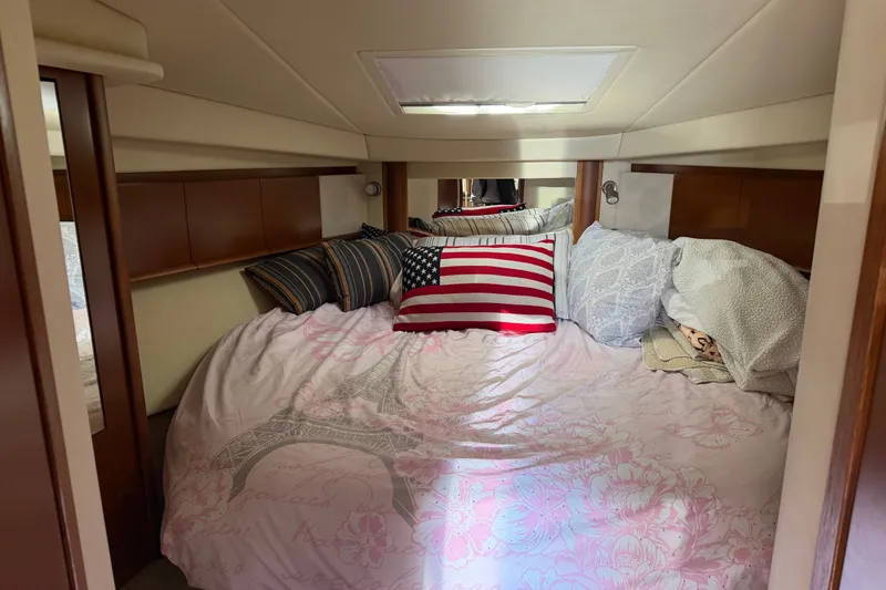 Slide: The Image of Cozy cabin interior of 2007 Sea Ray 40 Sundancer with decorative pillows and bedding. - 17