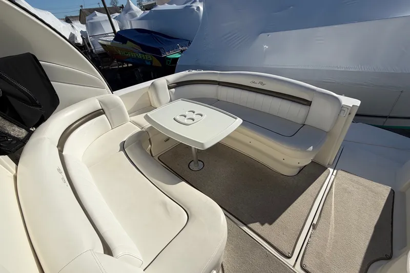 Slide: The Image of 2007 Sea Ray 40 Sundancer yacht interior with white seating and table. - 25