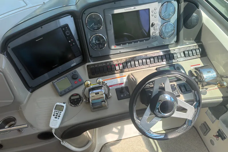Slide: The Image of Control panel of a 2007 Sea Ray 40 Sundancer boat with navigation equipment. - 16