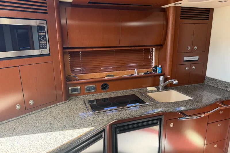 Slide: The Image of Luxurious 2007 Sea Ray 40 Sundancer yacht kitchen with granite countertops and modern appliances. - 6