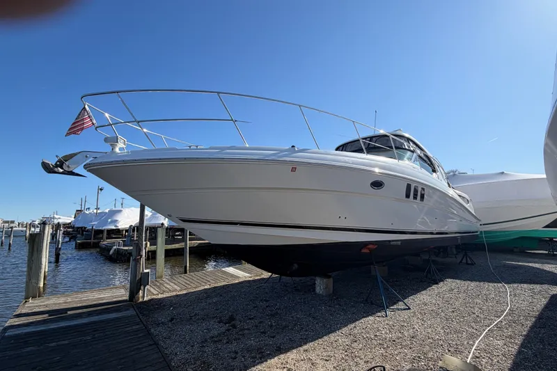 Slide: The Image of 2007 Sea Ray 40 Sundancer yacht docked at marina under clear blue sky. - 3