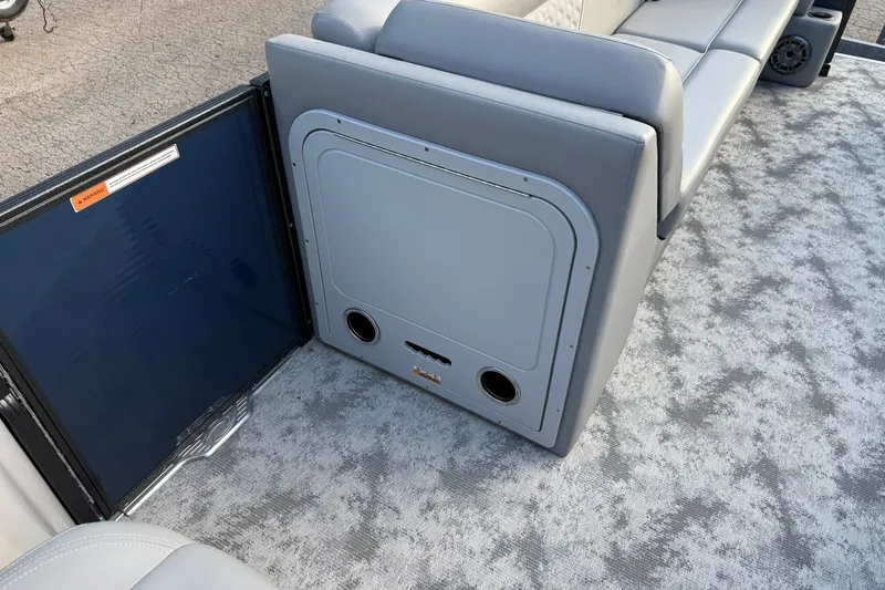 Slide: The Image of Interior of 2022 Crest 240 Classic CPTD pontoon boat with gray seating and flooring. - 14