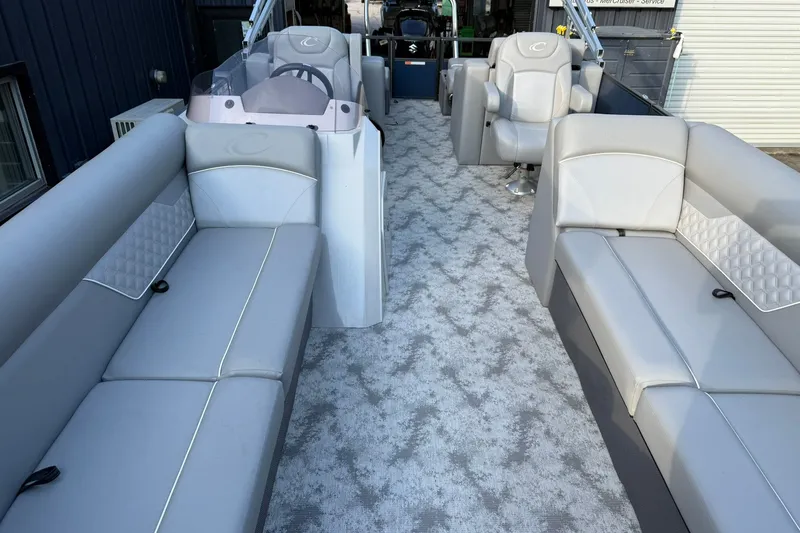 Slide: The Image of 2022 Crest 240 Classic CPTD pontoon boat interior with plush seating and modern design. - 6