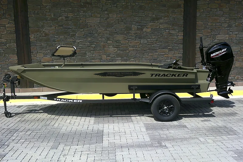 The Image of 2026 Tracker Grizzly 1650 T Prairie Wings Edition boat on trailer, side view. - 0
