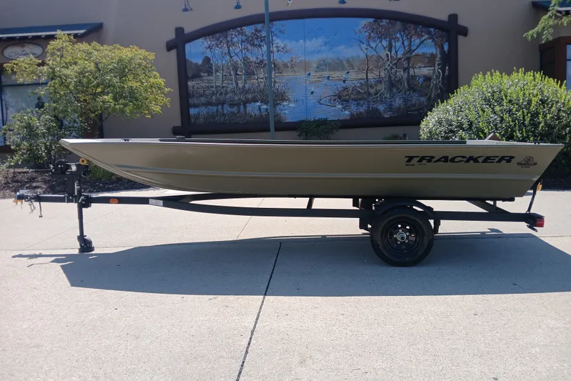The Image of 2027 Tracker Grizzly 1648 Utility boat on trailer, outdoor setting. - 0