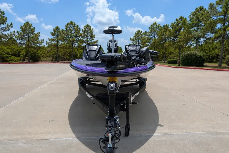 Slide: The Image of 2027 Nitro Z18 XL Pro boat on trailer, parked outdoors under clear sky. - 1