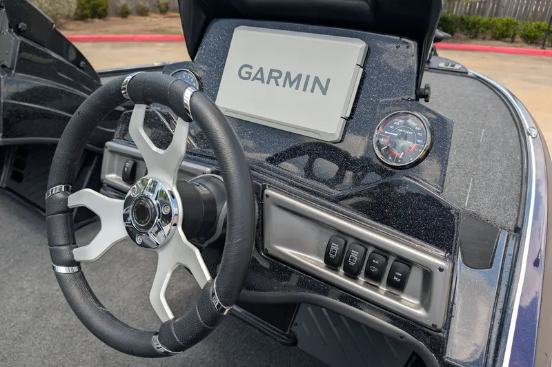 Slide: The Image of Steering wheel and dashboard of 2027 Nitro Z18 XL Pro boat with Garmin display. - 7