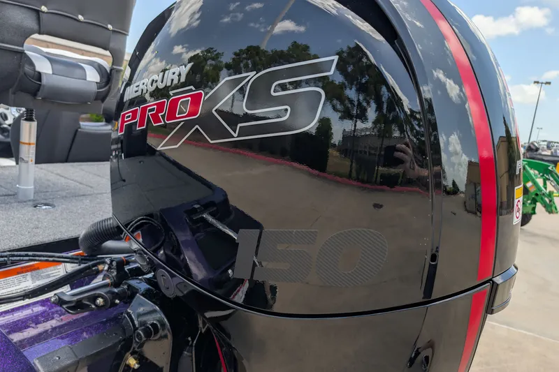 Slide: The Image of Mercury Pro XS 150 engine on 2027 Nitro Z18 XL Pro boat, reflecting sky and surroundings. - 11