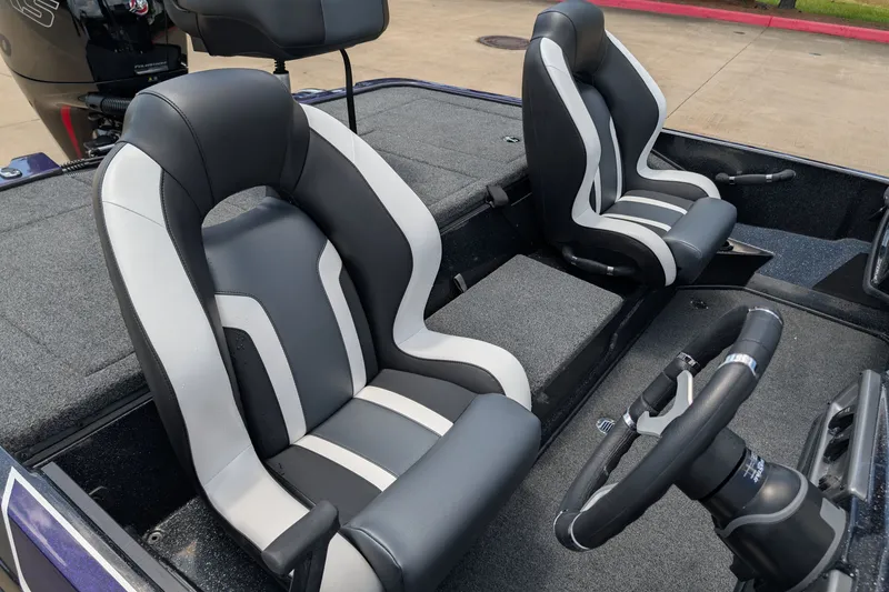 Slide: The Image of 2027 Nitro Z18 XL Pro boat interior with sleek black and white seats and steering wheel. - 8