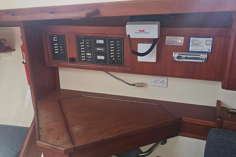 Slide: The Image of Control panel of a 1994 Tartan 3100 sailboat with radio and electrical switches. - 11