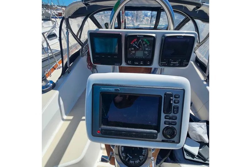 Slide: The Image of Cockpit of 1994 Tartan 3100 sailboat with navigation instruments and compass. - 4