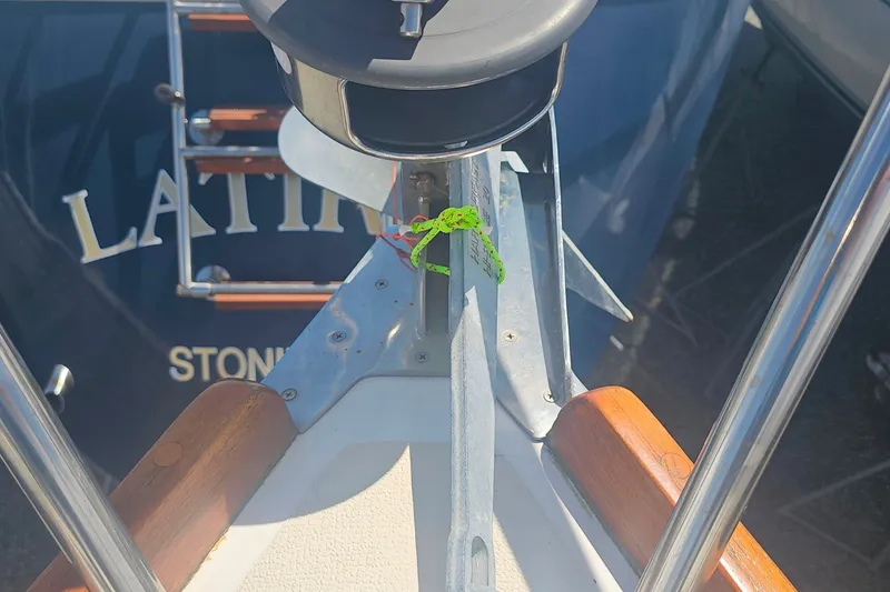 Slide: The Image of Bow of a 1994 Tartan 3100 sailboat with anchor and green rope. - 6