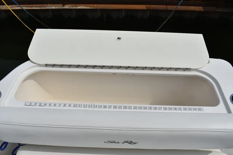 Slide: The Image of Open storage compartment on 2007 Sea Ray 270 Amberjack boat with measuring scale. - 11