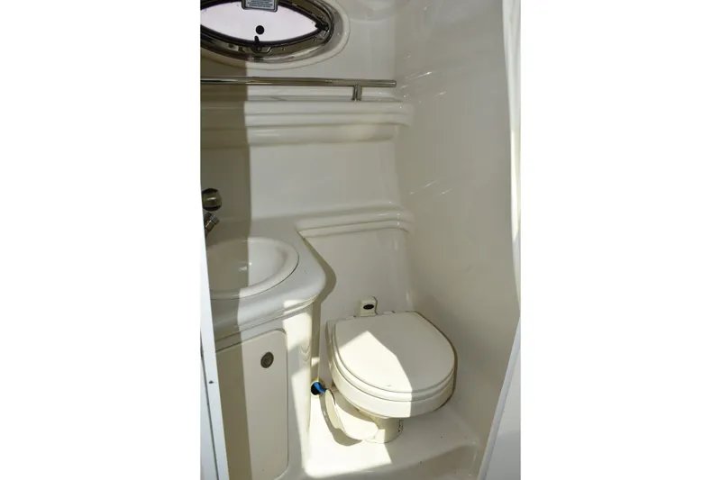 Slide: The Image of 2007 Sea Ray 270 Amberjack boat bathroom with sink and toilet. - 23