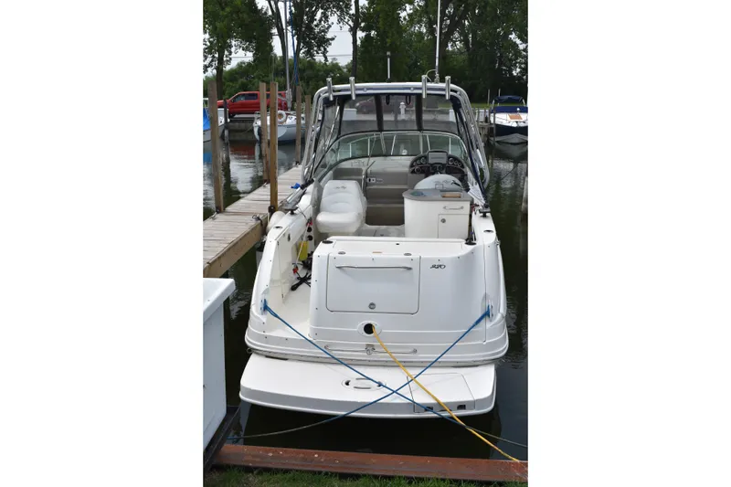 Slide: The Image of 2007 Sea Ray 270 Amberjack boat docked at marina, rear view. - 6