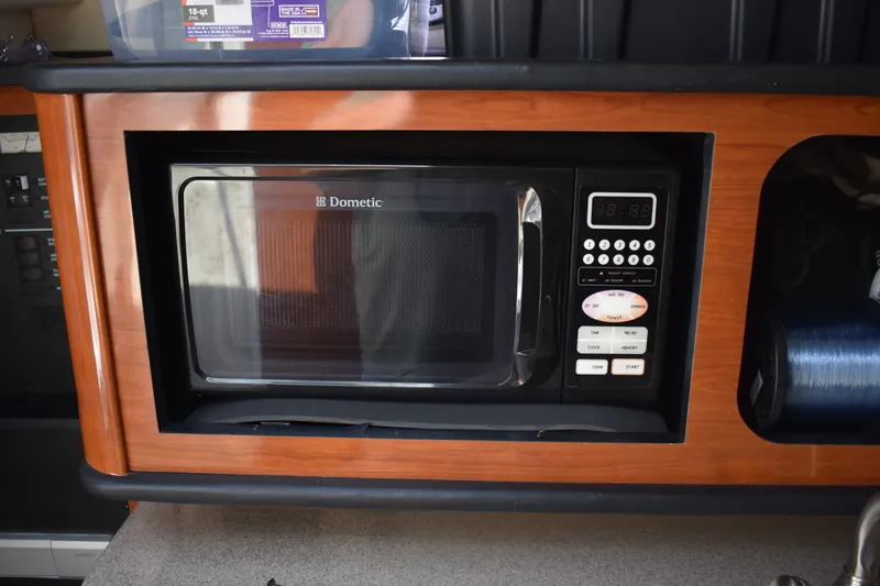 Slide: The Image of Built-in Dometic microwave in 2007 Sea Ray 270 Amberjack boat galley. - 21