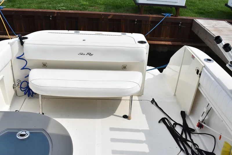 Slide: The Image of 2007 Sea Ray 270 Amberjack boat interior with white seating and deck details. - 10