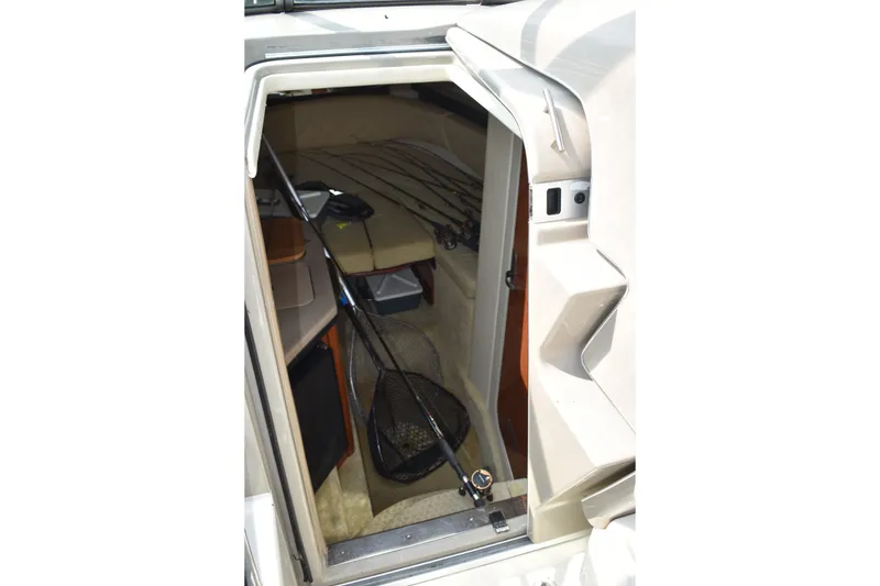 Slide: The Image of Interior view of 2007 Sea Ray 270 Amberjack cabin with fishing gear. - 17