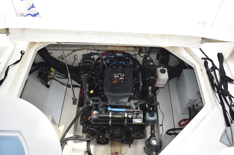 Slide: The Image of Engine compartment of a 2007 Sea Ray 270 Amberjack boat, showcasing mechanical components. - 15