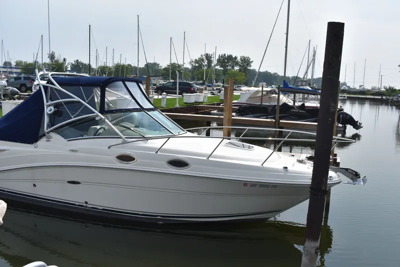Slide: The Image of 2007 Sea Ray 270 Amberjack docked at a marina with other boats. - 3