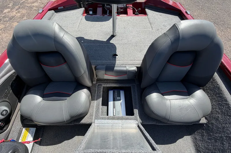 Slide: The Image of 2023 Bass Tracker Pro 17 boat interior with gray seats and storage compartment. - 24