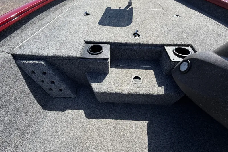 Slide: The Image of 2023 Bass Tracker Pro 17 boat interior with carpeted deck and cup holders. - 20