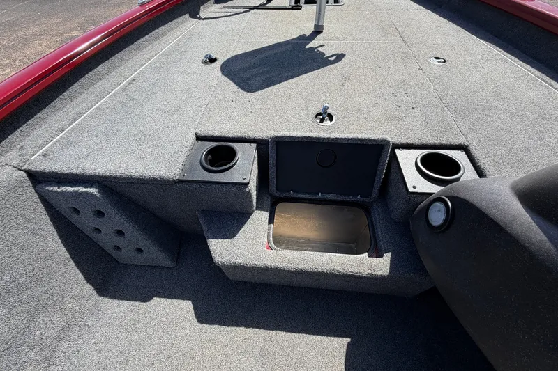 Slide: The Image of 2023 Bass Tracker Pro 17 boat interior with storage compartments and cup holders. - 21