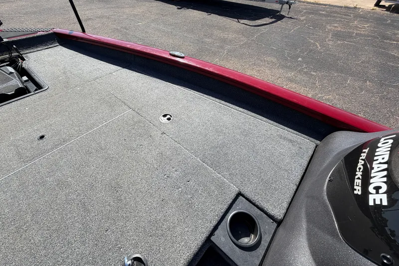 Slide: The Image of 2023 Bass Tracker Pro 17 boat deck with Lowrance equipment, featuring a red trim. - 18