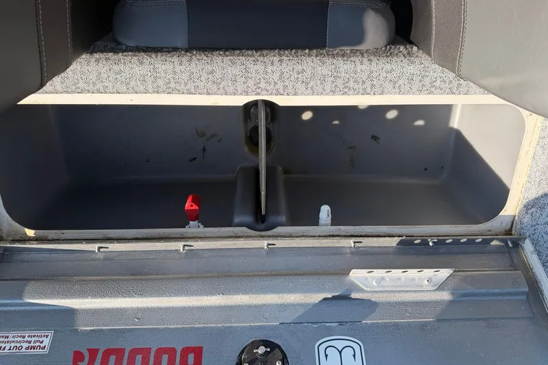 Slide: The Image of 2023 Tracker Pro Team 190 TX Tournament Edition boat storage compartment. - 51