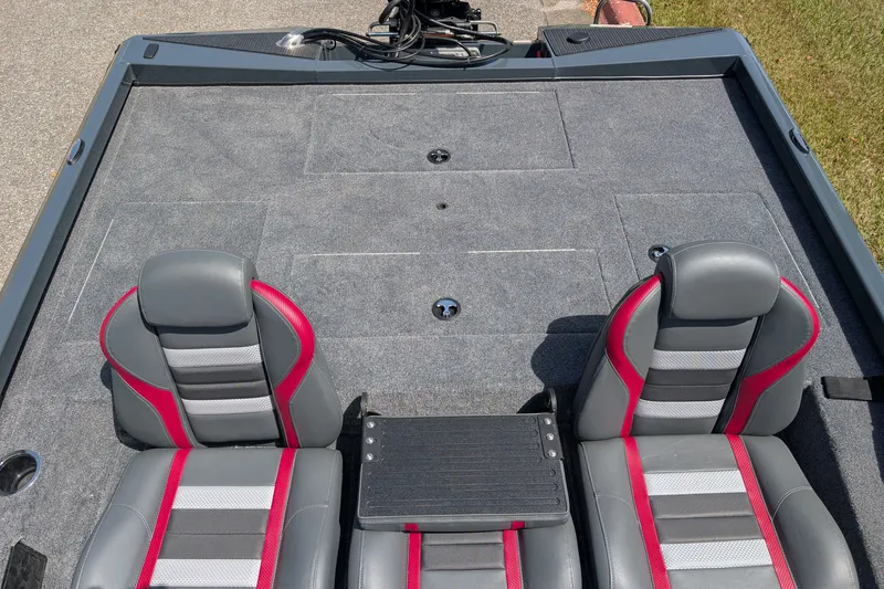 Slide: The Image of 2027 Ranger RT198P boat interior with gray and red seats, spacious deck. - 5