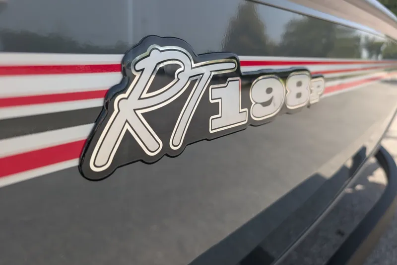 Slide: The Image of 2027 Ranger RT198P boat logo with red and black stripes. - 2