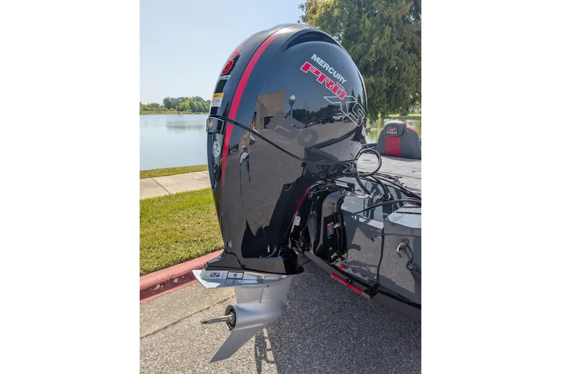 Slide: The Image of 2027 Ranger RT198P boat with Mercury Pro XS engine by a lake. - 9