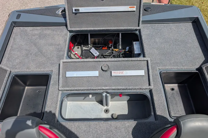 Slide: The Image of 2027 Ranger RT198P boat deck with open storage compartments and visible wiring. - 7
