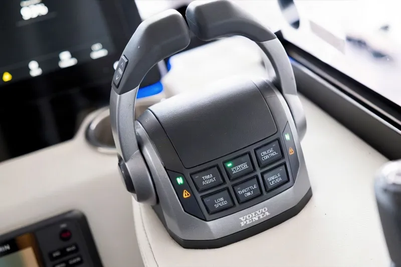 Slide: The Image of Volvo Penta throttle control on 2025 Regal 42 Grande Coupe yacht dashboard. - 14