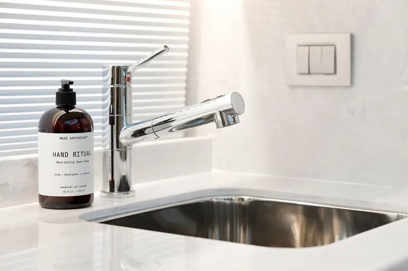 Slide: The Image of Modern bathroom sink with chrome faucet and hand soap bottle, Regal 42 Grande Coupe 2025. - 22